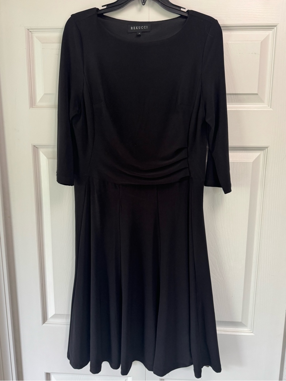 Rekucci A-line black dress with 3/4 length sleeves. Size 12.